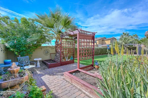 a view of a patio with furniture and a potted plants