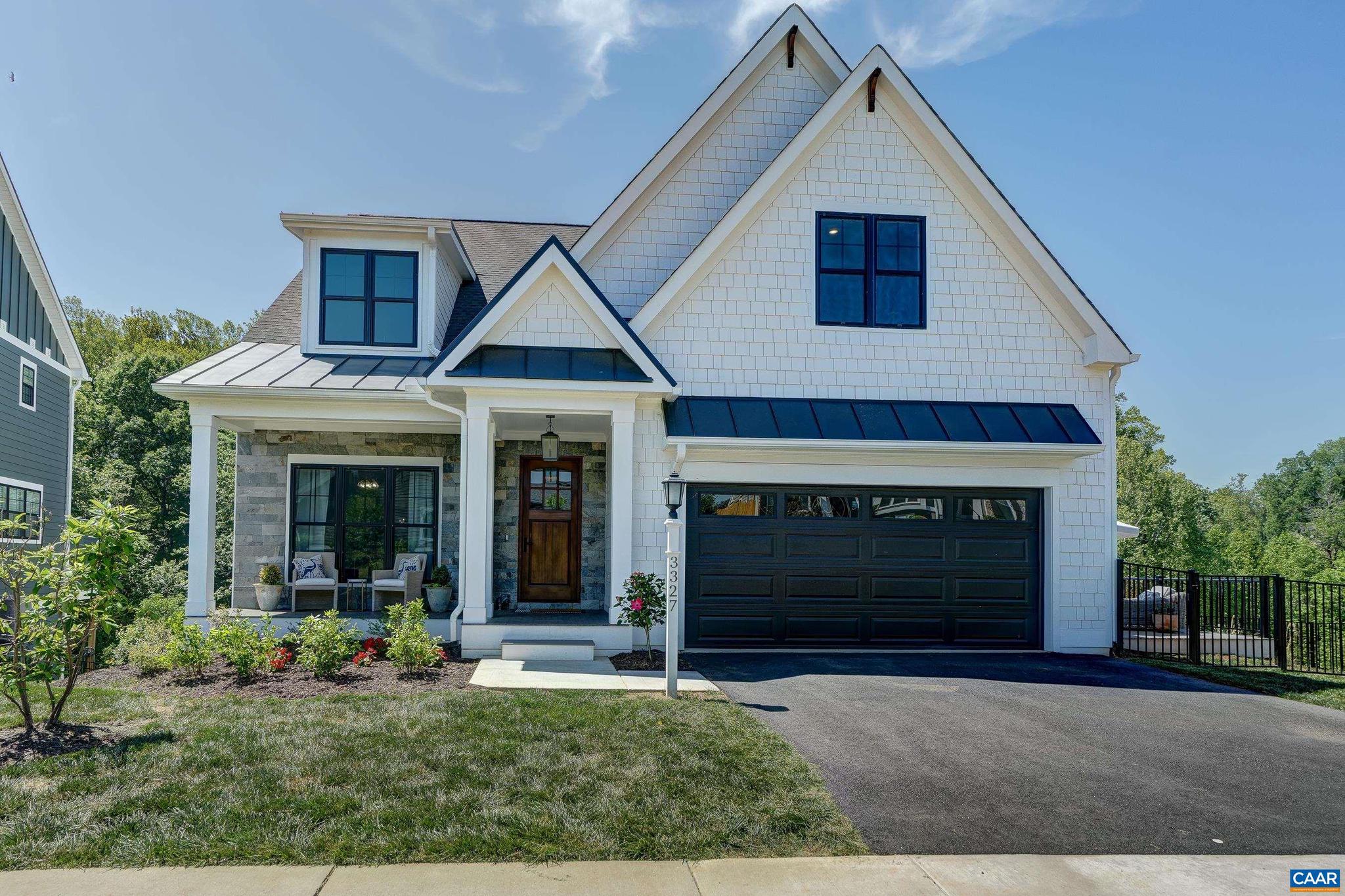3327 Rowcross Street Crozet, VA 22932 - Photo 54 of 63 a front view of a house with a yard and garage