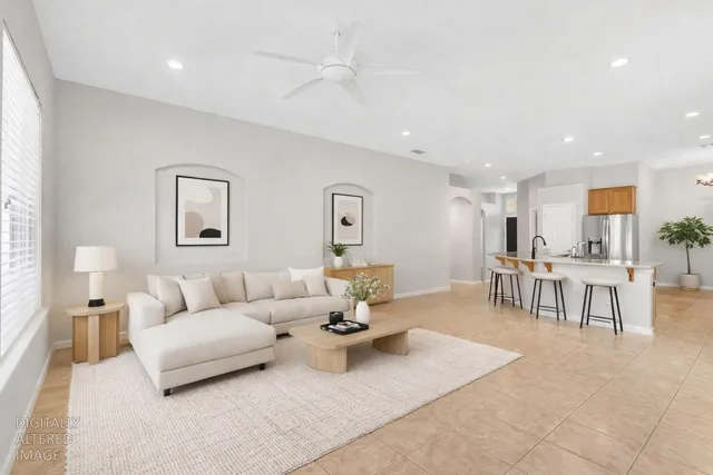 a living room with furniture and a table