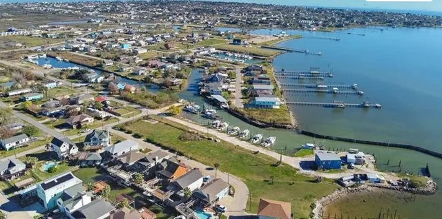an aerial view of a city with ocean view