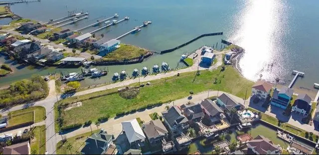 an aerial view of a house a yard and a swimming pool