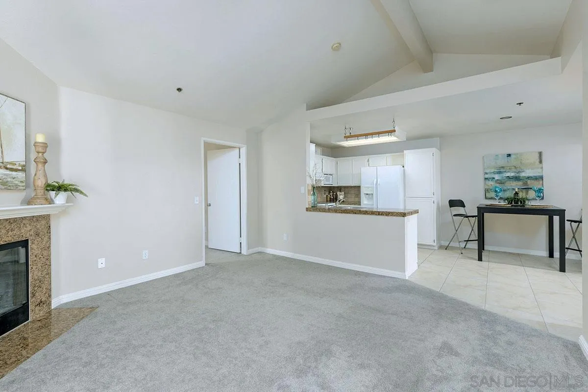 17161 Alva Road, Unit 931 San Diego, CA 92127 - Photo 12 of 30 a view of a kitchen with furniture and a kitchen