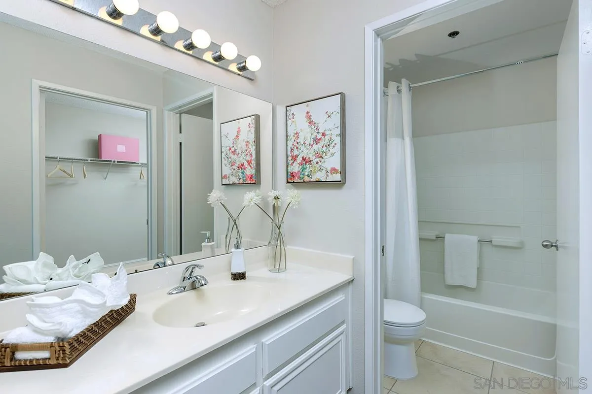 17161 Alva Road, Unit 931 San Diego, CA 92127 - Photo 17 of 30 a bathroom with a sink vanity granite and toilet