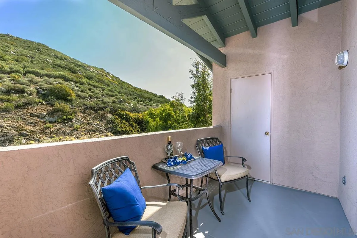 17161 Alva Road, Unit 931 San Diego, CA 92127 - Photo 2 of 30 a view of balcony with table and chairs