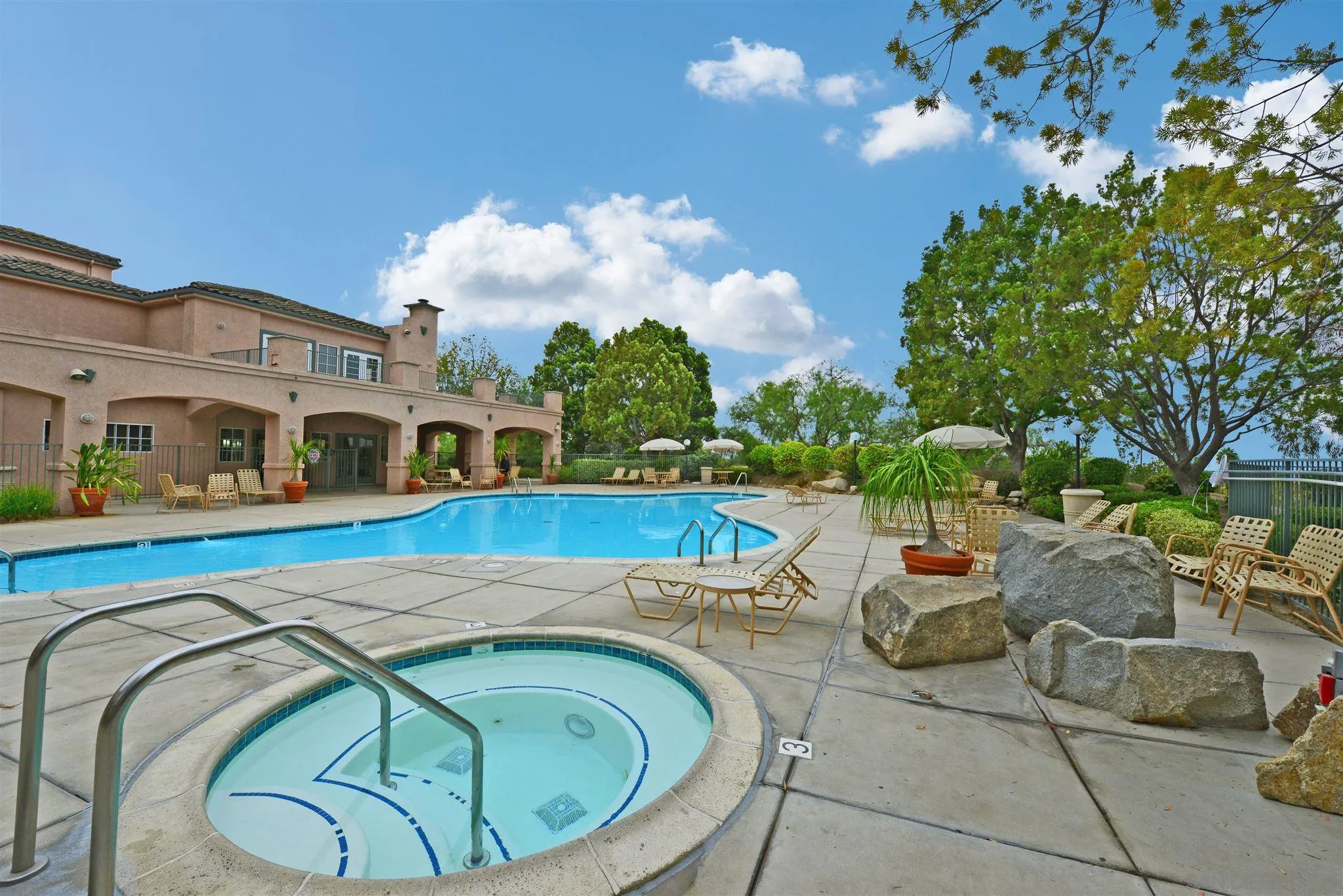 17161 Alva Road, Unit 931 San Diego, CA 92127 - Photo 27 of 30 a swimming pool with outdoor seating and yard