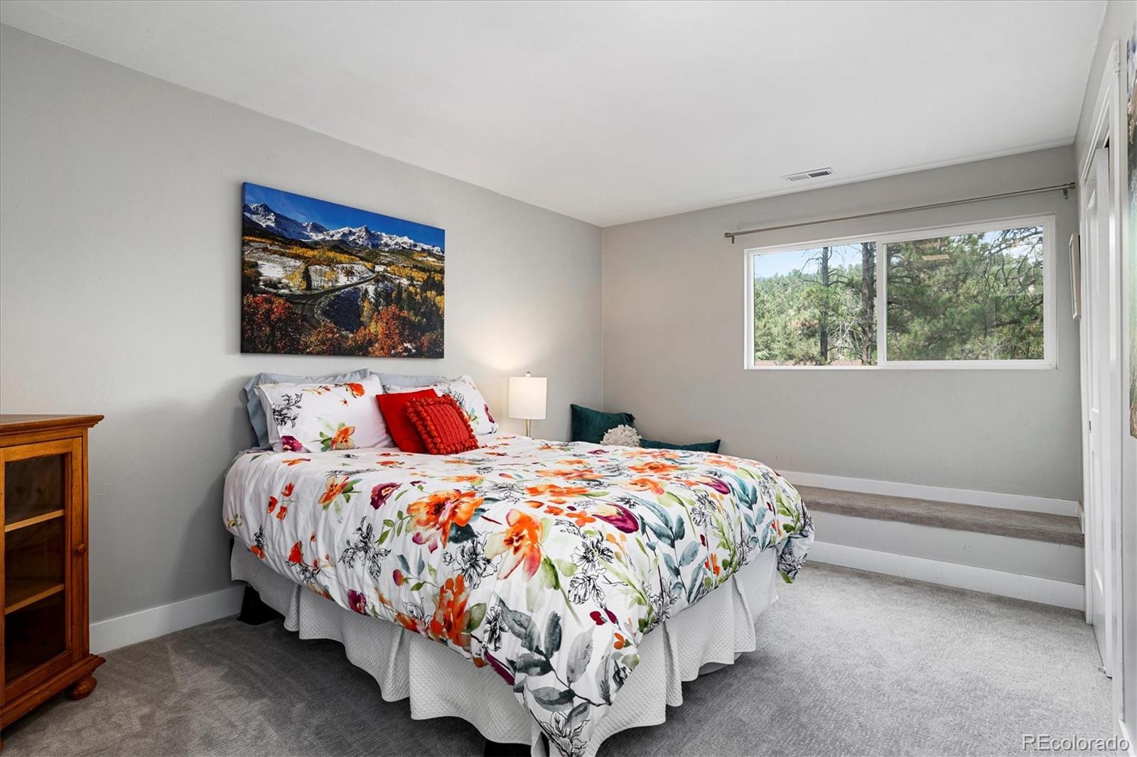 28867 Cedar Circle Evergreen, CO 80439 - Photo 14 of 35 a bedroom with bed and a window