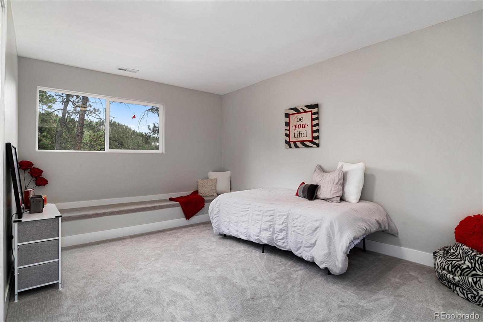 28867 Cedar Circle Evergreen, CO 80439 - Photo 15 of 35 a bedroom with a bed and a window