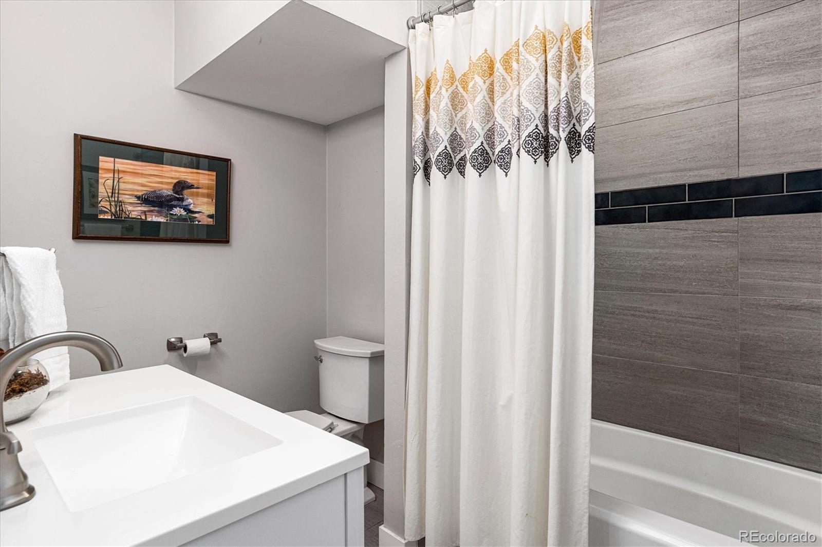 28867 Cedar Circle Evergreen, CO 80439 - Photo 16 of 35 a bathroom with a sink and a mirror