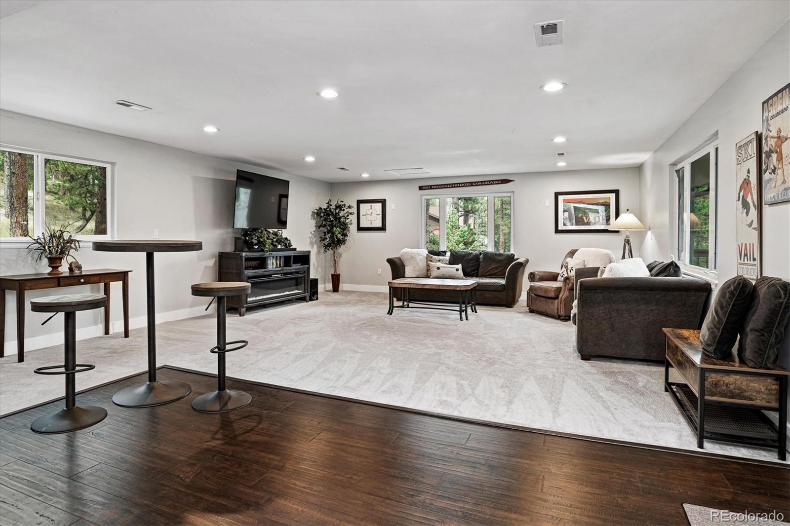 28867 Cedar Circle Evergreen, CO 80439 - Photo 18 of 35 a living room with furniture and a wooden floor