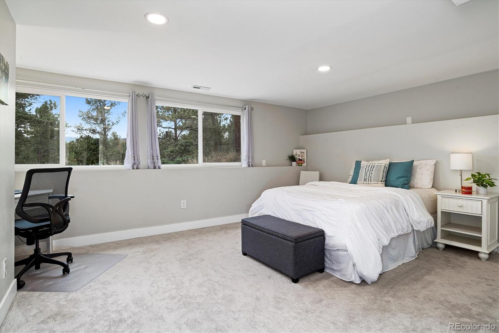 28867 Cedar Circle Evergreen, CO 80439 - Photo 21 of 35 a bedroom with a bed and a window