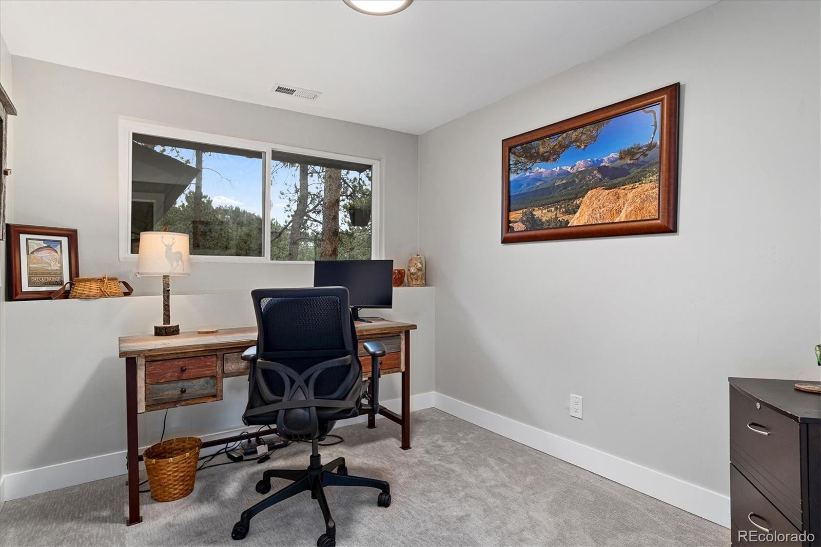 28867 Cedar Circle Evergreen, CO 80439 - Photo 23 of 35 a view of a workspace with furniture and a window