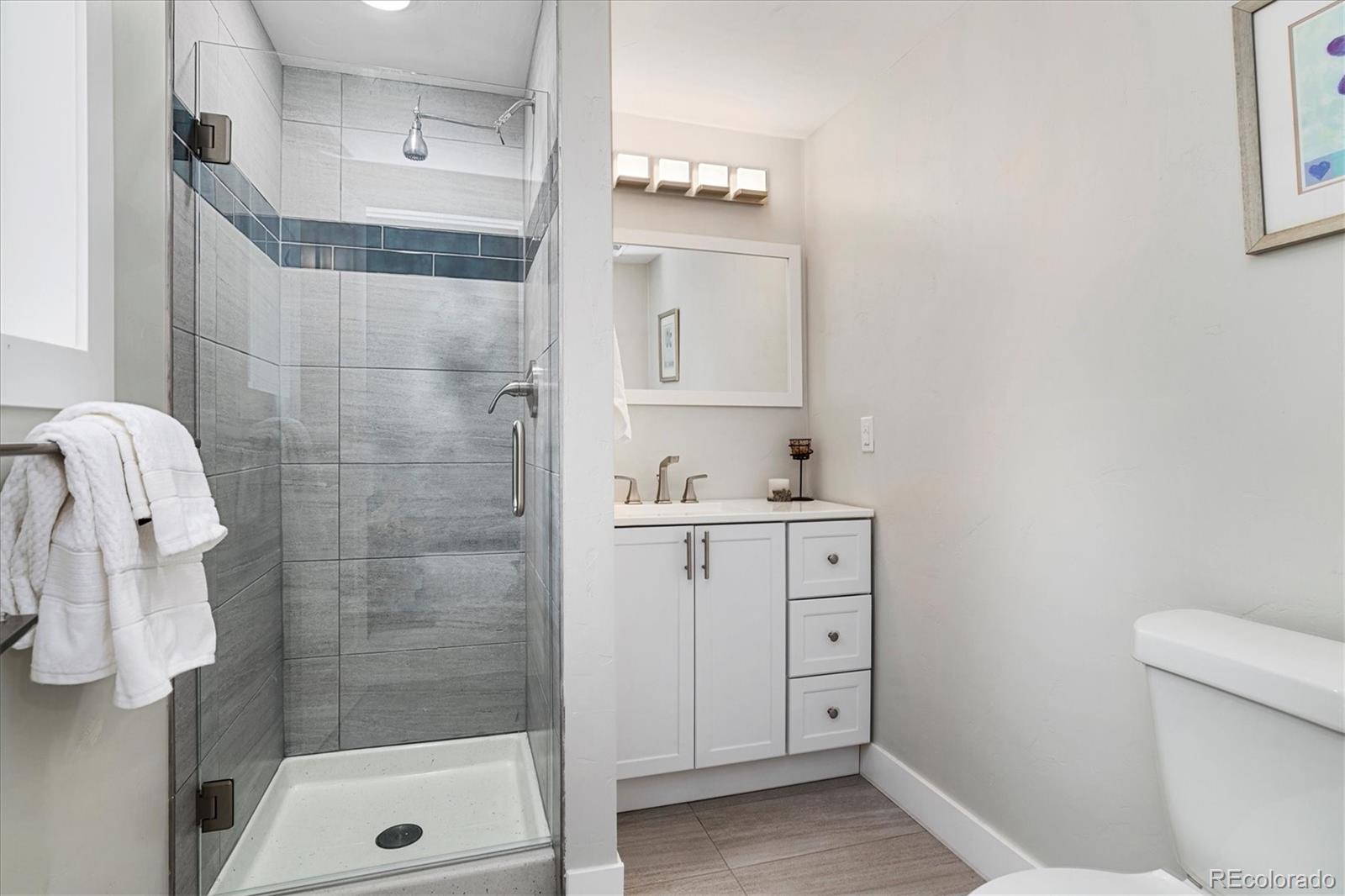 28867 Cedar Circle Evergreen, CO 80439 - Photo 25 of 35 a bathroom with a sink a toilet and shower