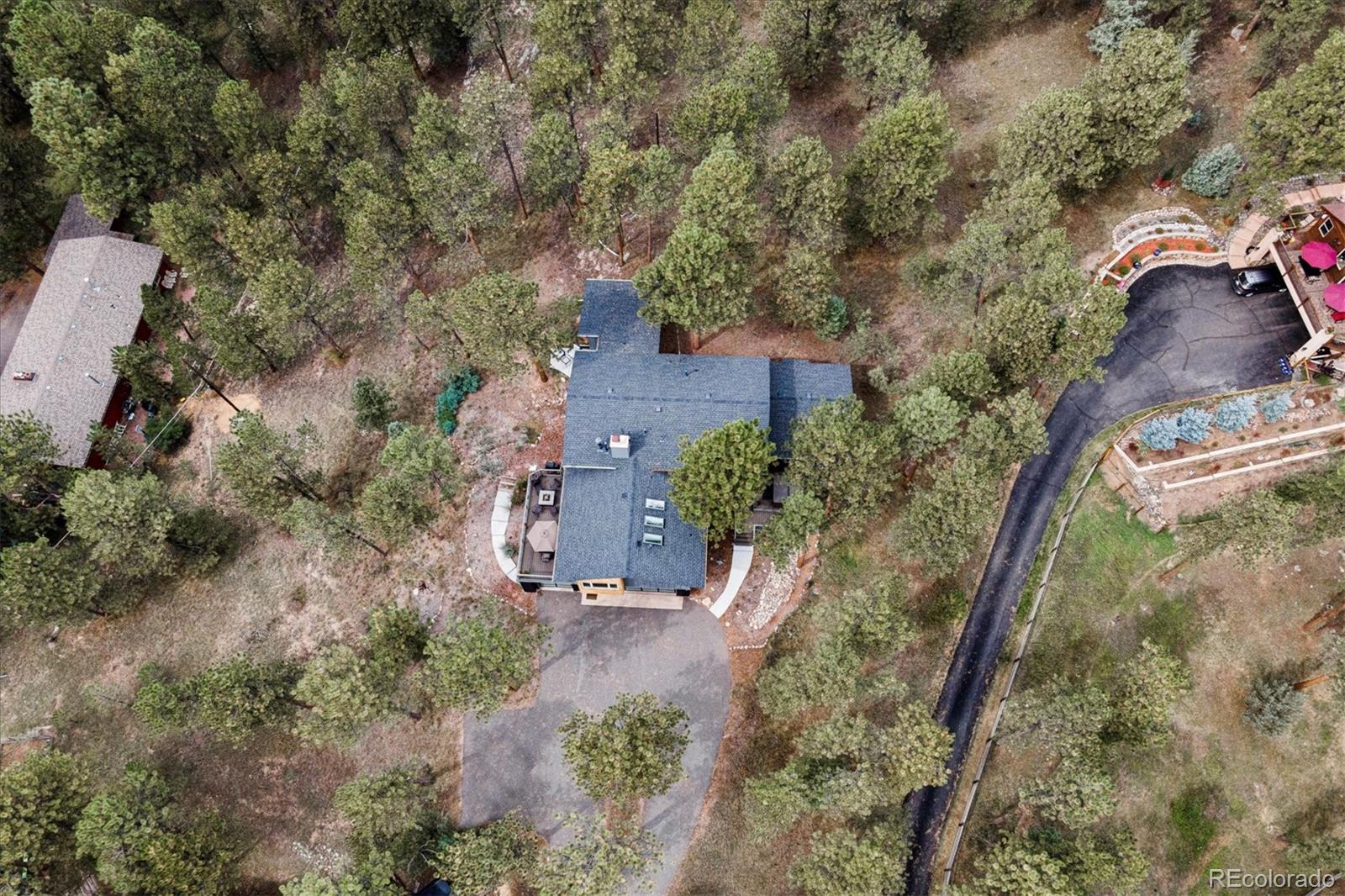 28867 Cedar Circle Evergreen, CO 80439 - Photo 32 of 35 an aerial view of a house with a yard