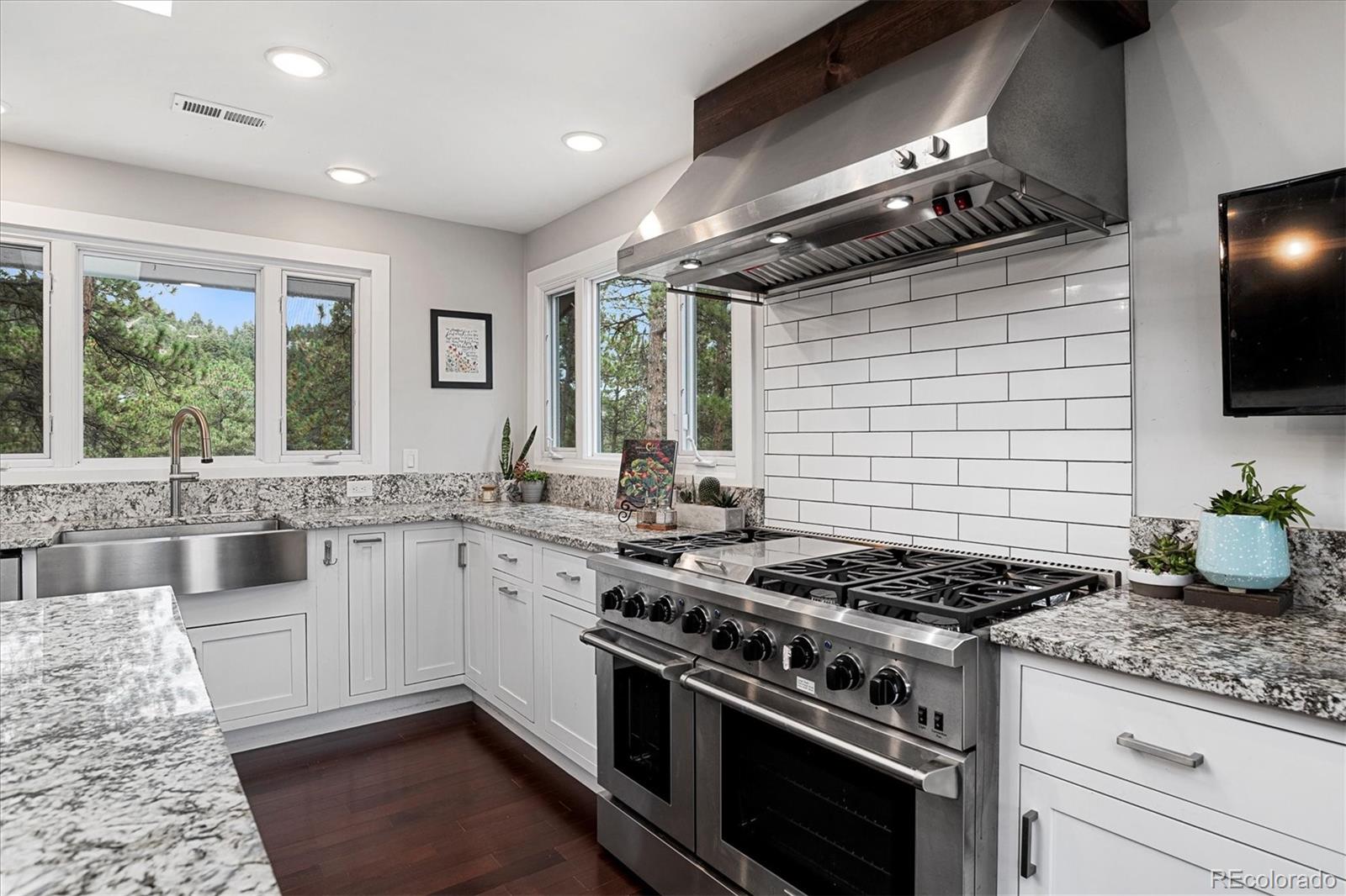 28867 Cedar Circle Evergreen, CO 80439 - Photo 5 of 35 a kitchen with a stove and a sink