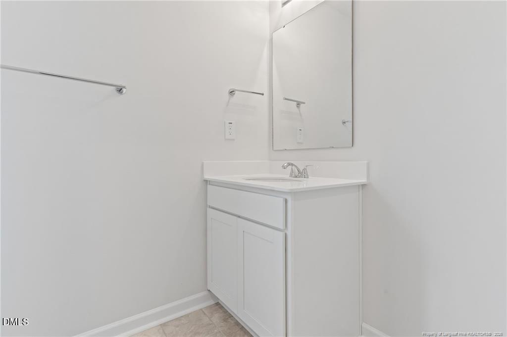100 Rubyfield Court Fremont, NC 27830 - Photo 28 of 38 a bathroom with a sink and vanity