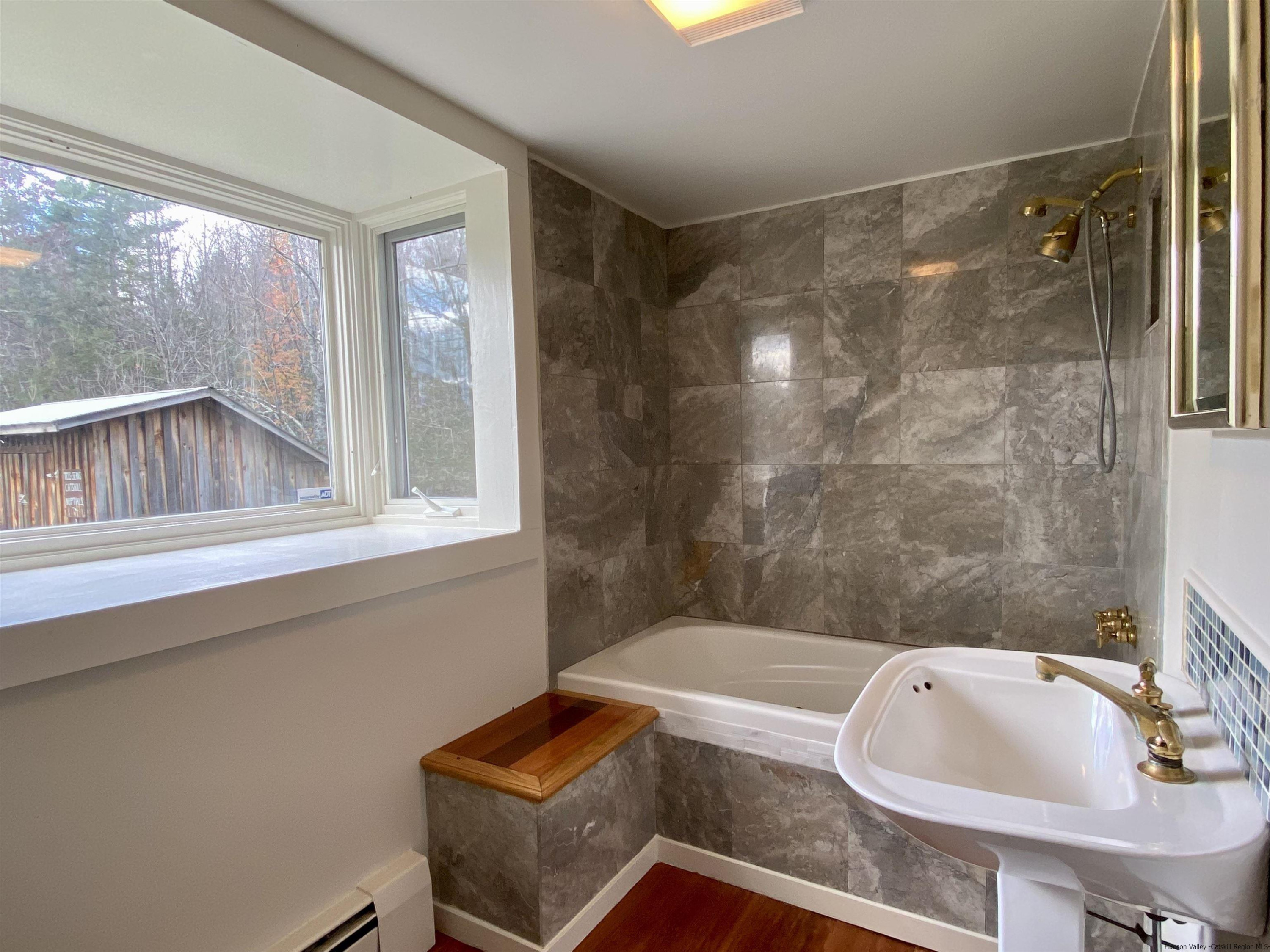 83 Palentown Road Kerhonkson, NY 12446 - Photo 12 of 30 a bathroom with a sink and a mirror
