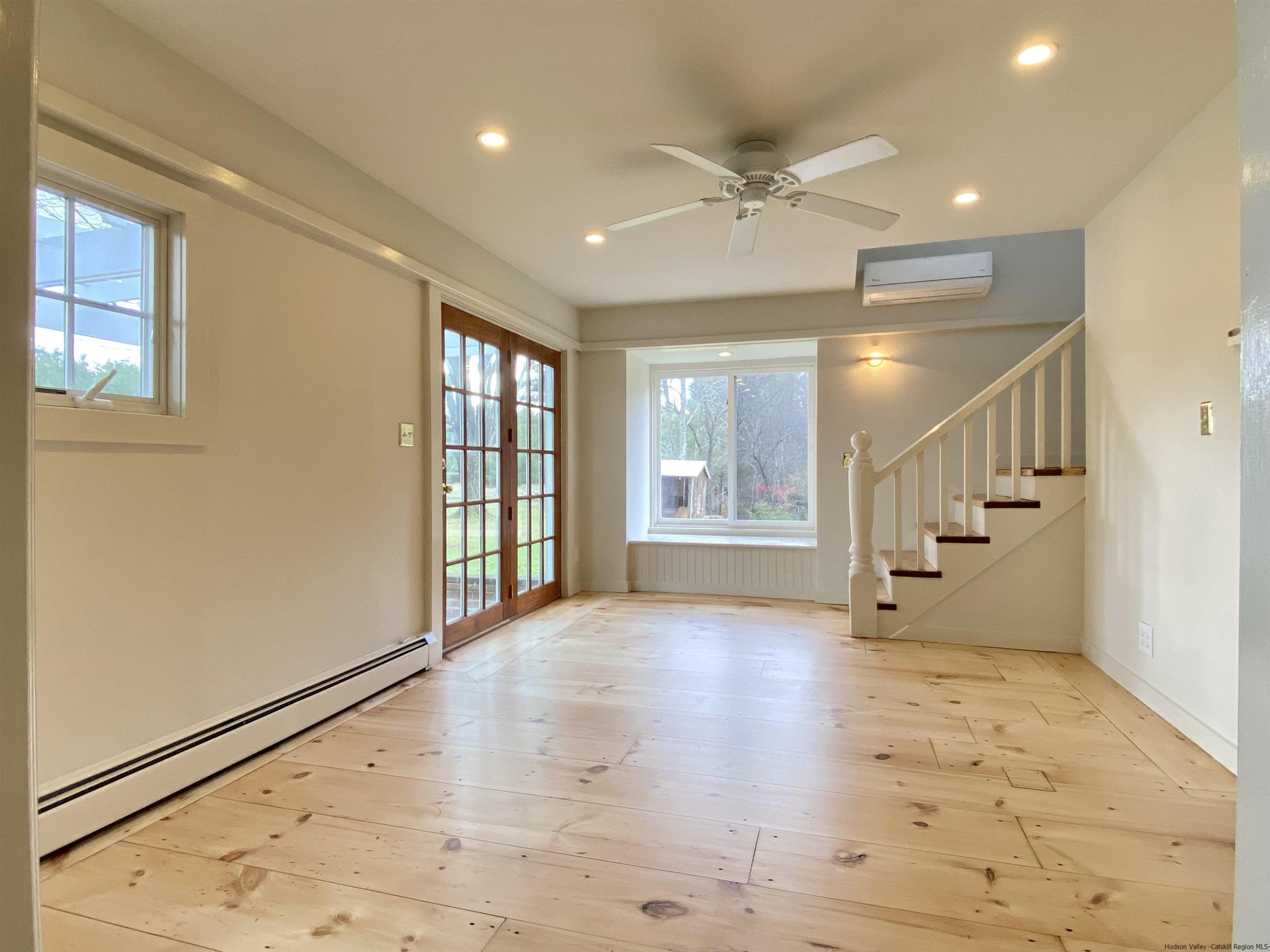 83 Palentown Road Kerhonkson, NY 12446 - Photo 14 of 30 a view of an empty room with wooden floor and a window