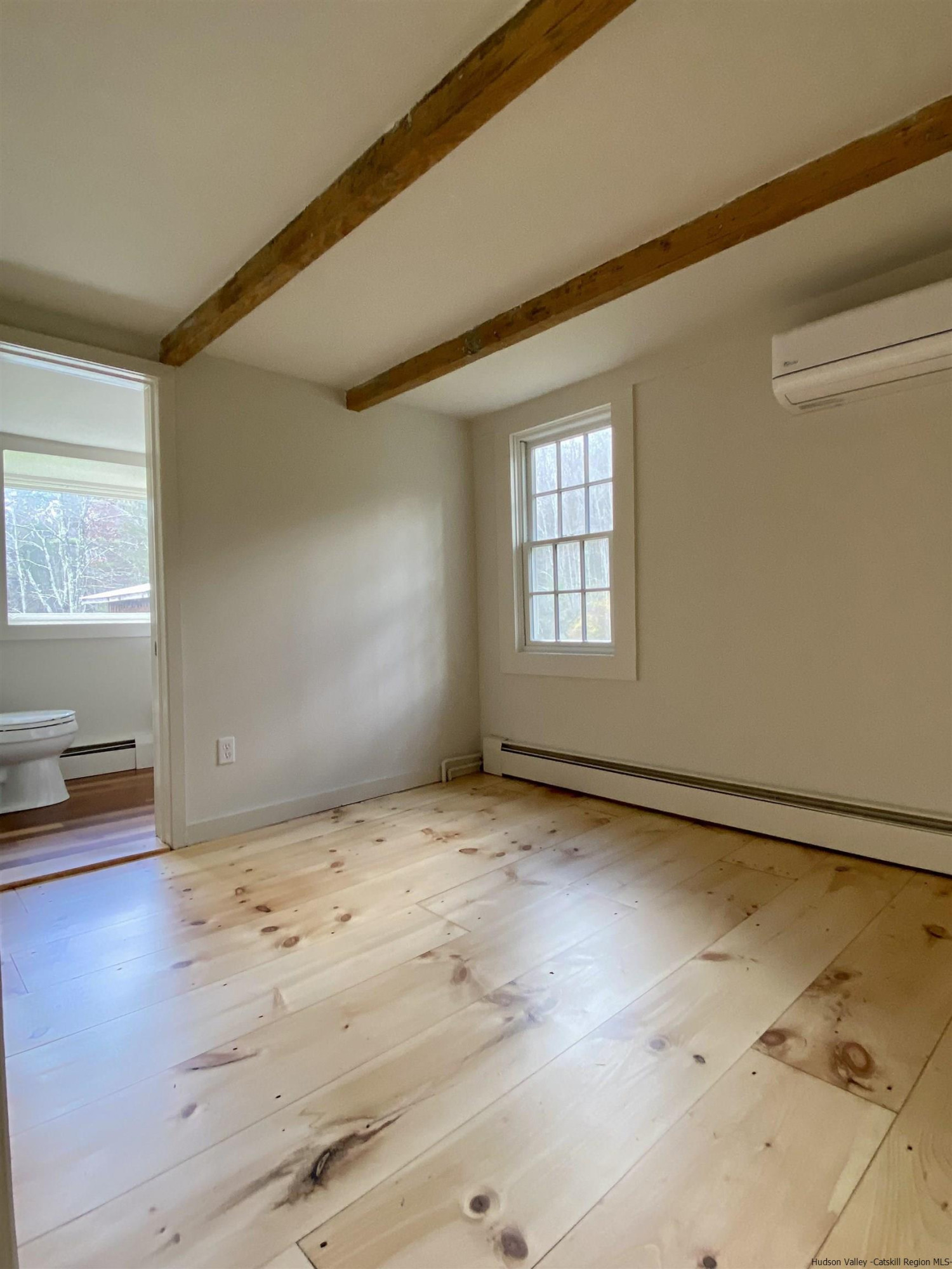 83 Palentown Road Kerhonkson, NY 12446 - Photo 23 of 30 an empty room with wooden floor and windows