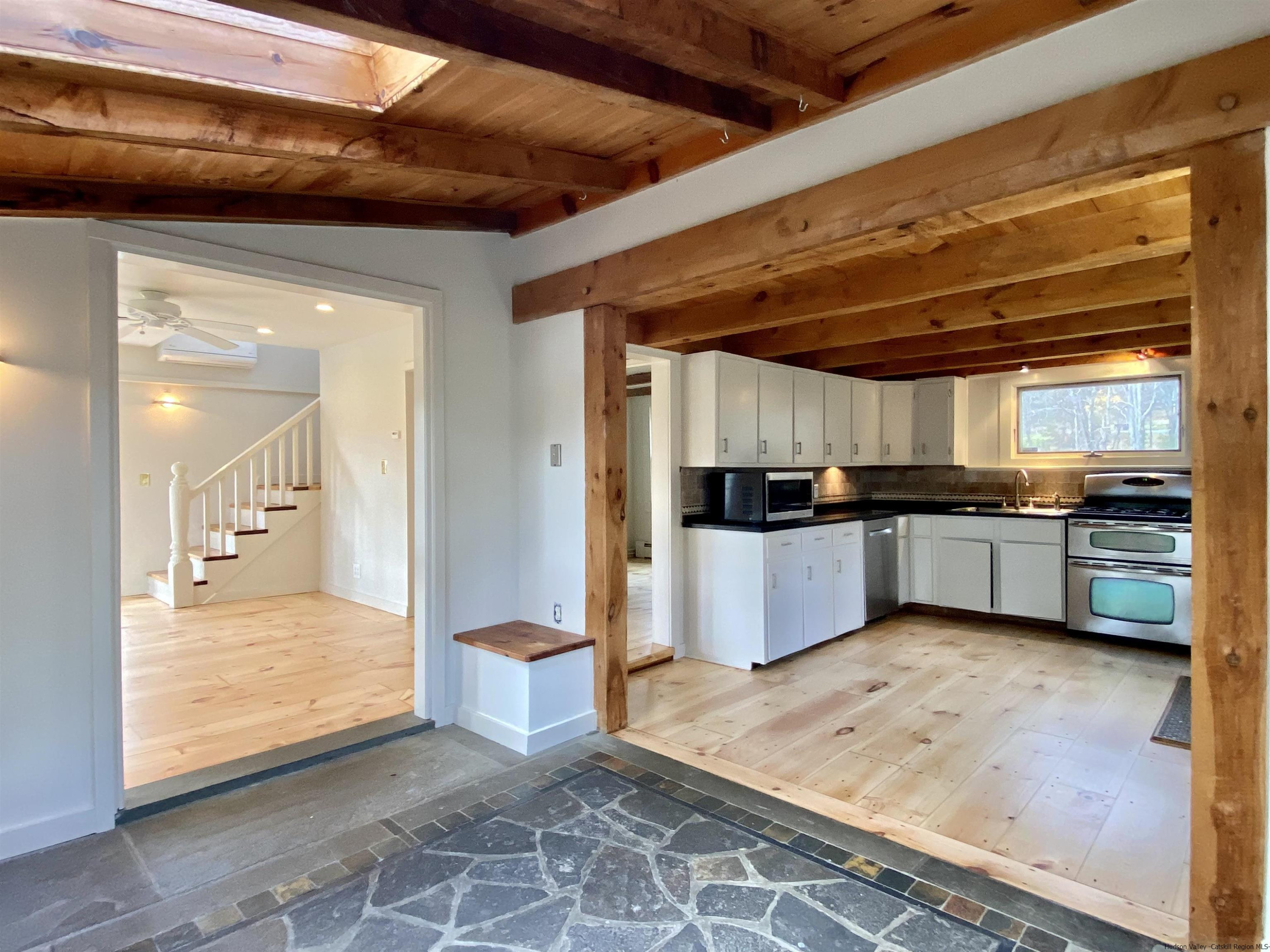 83 Palentown Road Kerhonkson, NY 12446 - Photo 6 of 30 a view of a kitchen with kitchen island a sink stainless steel appliances and cabinets