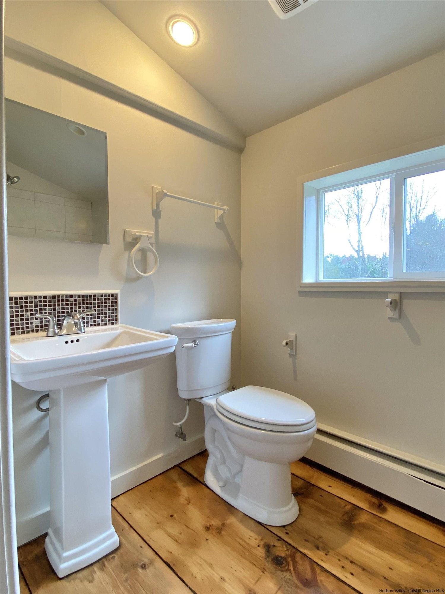 83 Palentown Road Kerhonkson, NY 12446 - Photo 10 of 30 a bathroom with a sink a toilet and a mirror