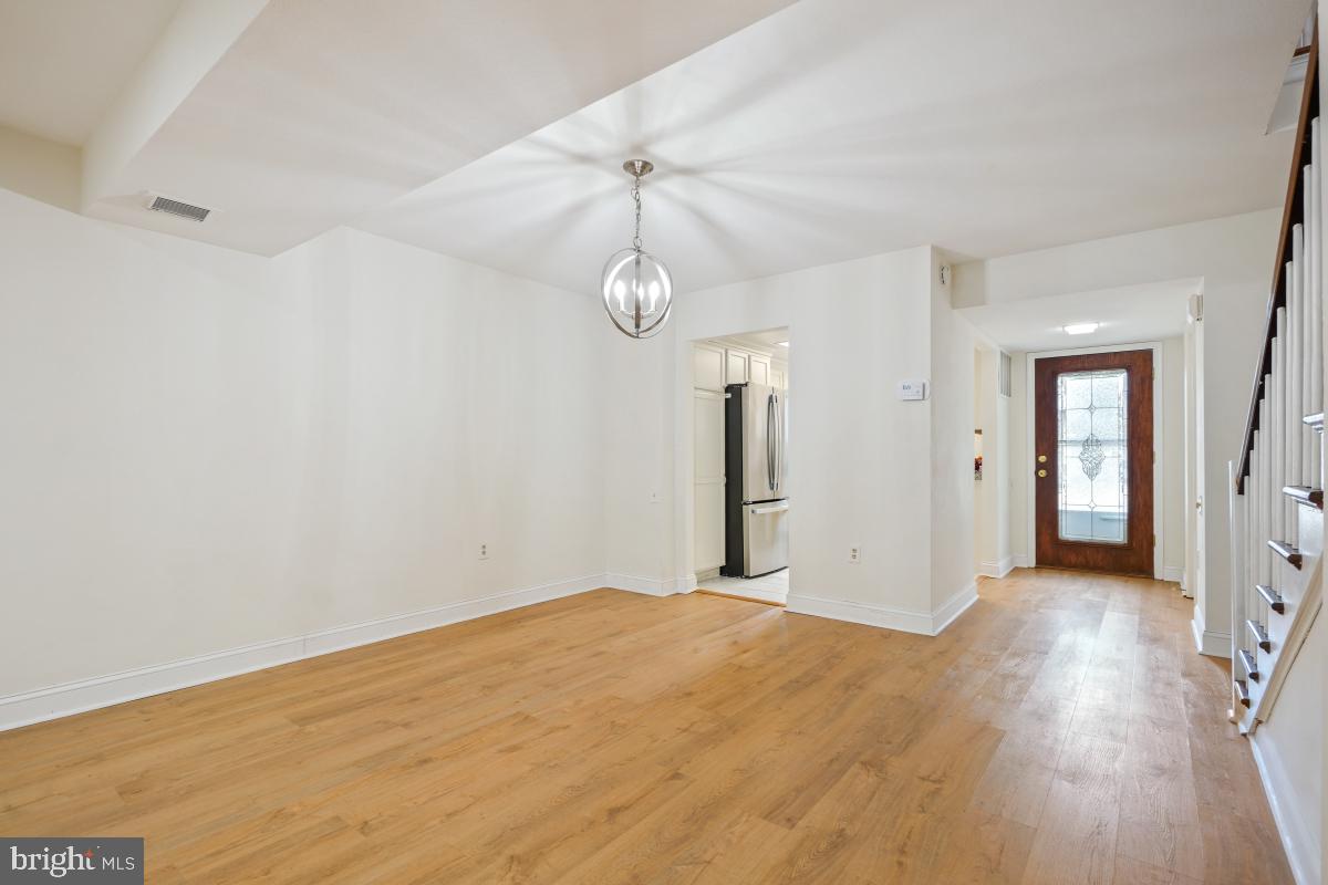 3434 Gleneagles Drive, Unit 78B Silver Spring, MD 20906 - Photo 13 of 31 a view of a room with wooden floor and white walls