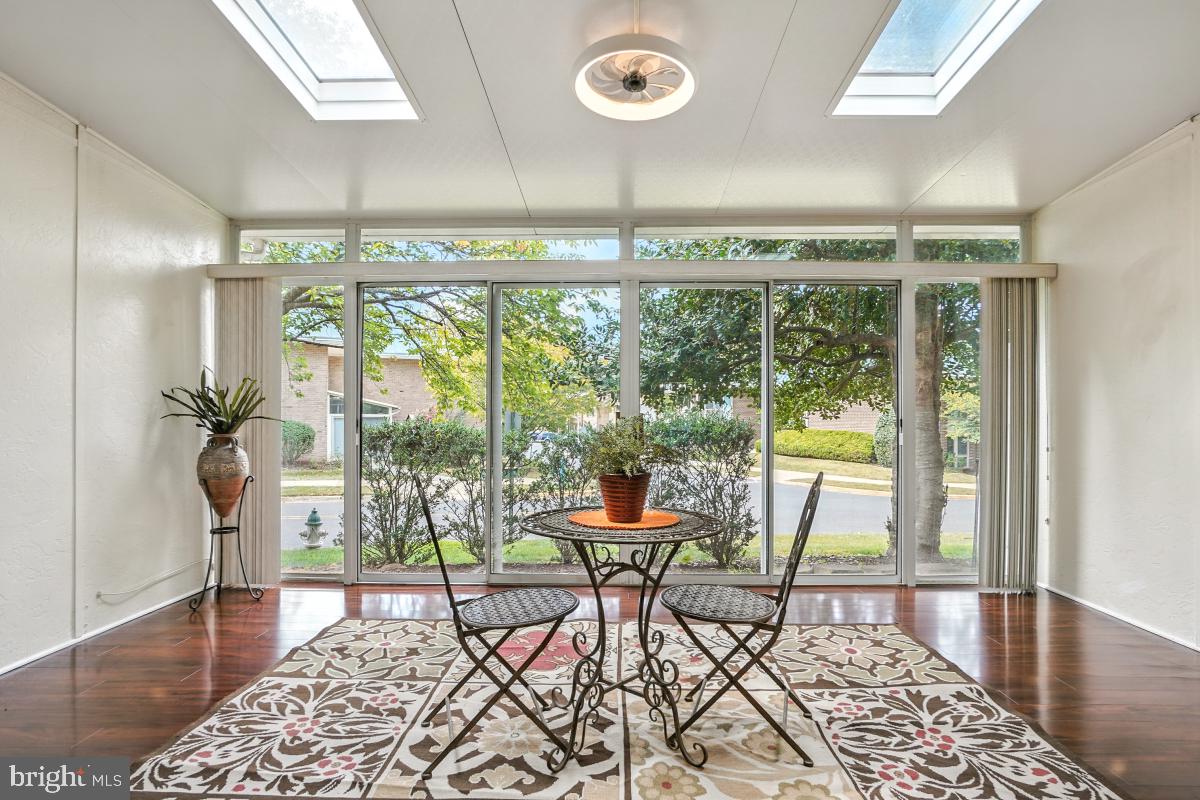3434 Gleneagles Drive, Unit 78B Silver Spring, MD 20906 - Photo 16 of 31 a living room with furniture and a large window
