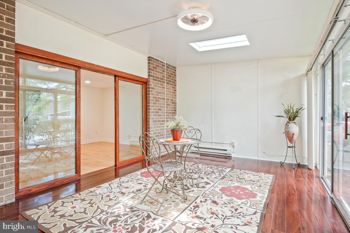 3434 Gleneagles Drive, Unit 78B Silver Spring, MD 20906 - Photo 18 of 31 a bedroom with a bed and wooden floor