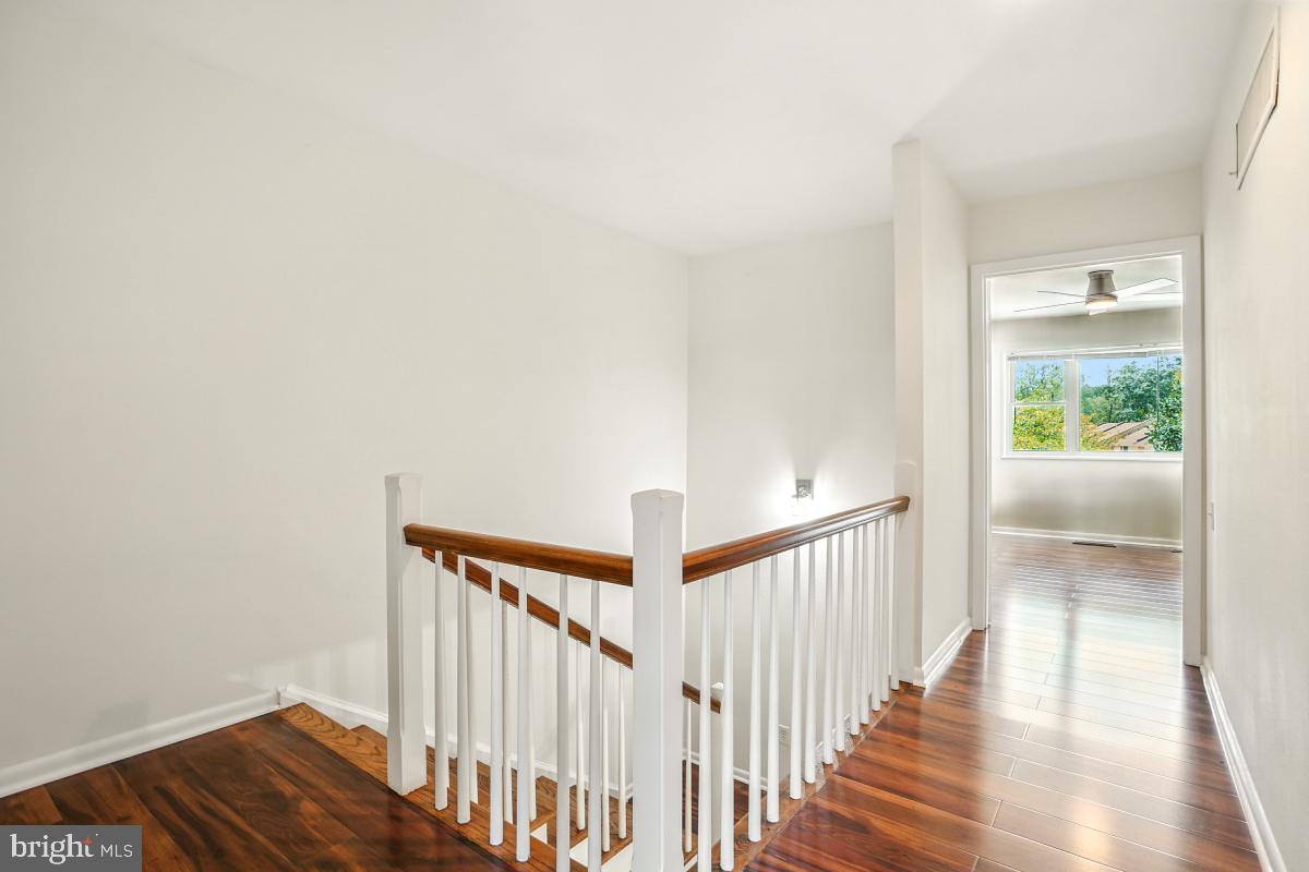 3434 Gleneagles Drive, Unit 78B Silver Spring, MD 20906 - Photo 21 of 31 a view of a hallway with wooden floor and entryway