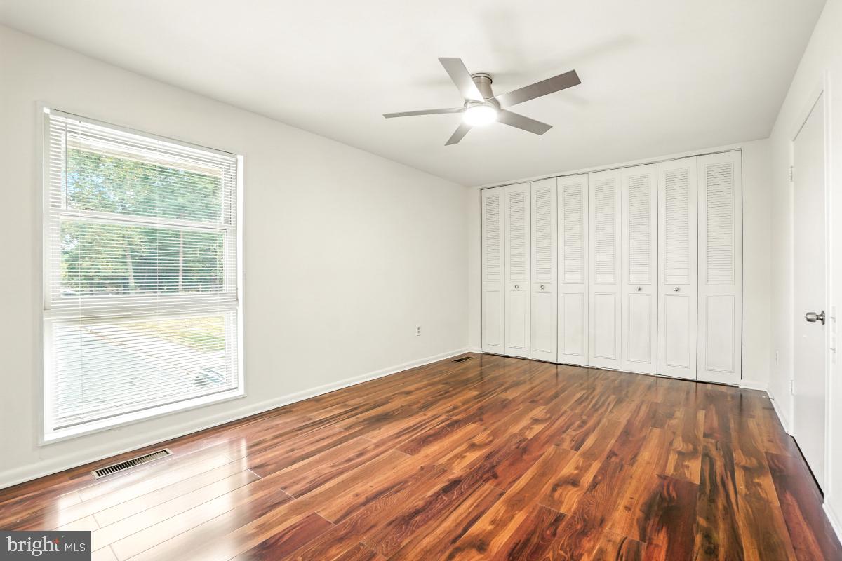 3434 Gleneagles Drive, Unit 78B Silver Spring, MD 20906 - Photo 28 of 31 a view of empty room with wooden floor and fan
