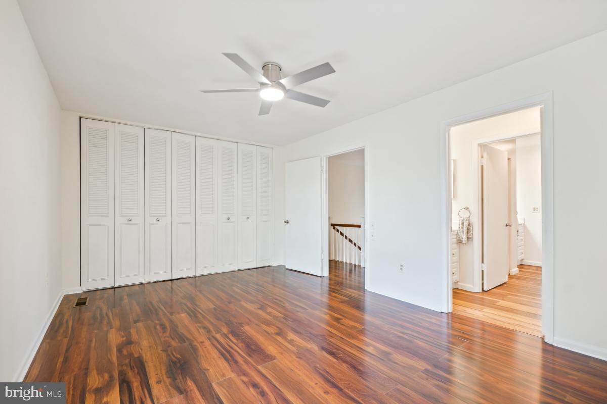 3434 Gleneagles Drive, Unit 78B Silver Spring, MD 20906 - Photo 30 of 31 a view of empty room with wooden floor and fan