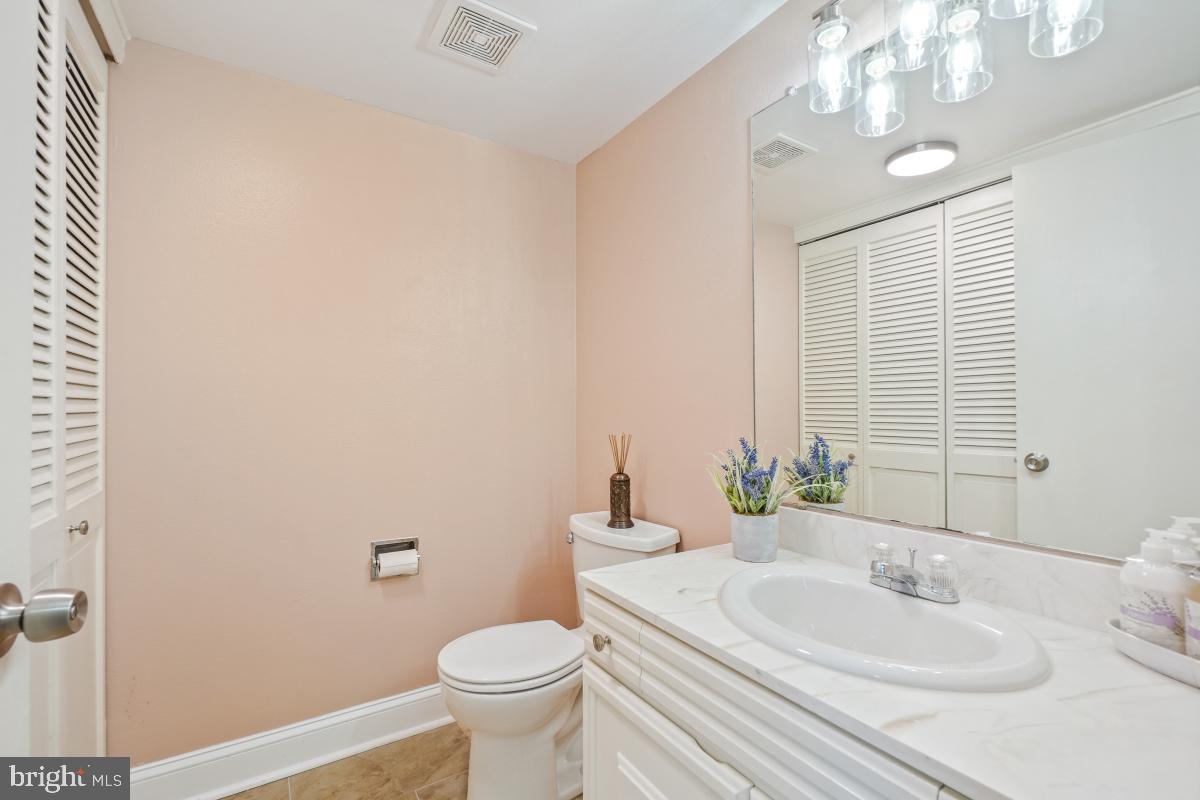 3434 Gleneagles Drive, Unit 78B Silver Spring, MD 20906 - Photo 5 of 31 a bathroom with a sink and a mirror