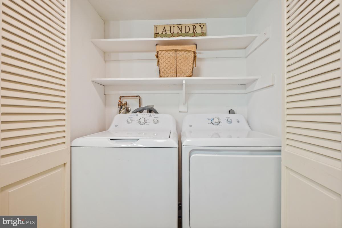 3434 Gleneagles Drive, Unit 78B Silver Spring, MD 20906 - Photo 6 of 31 a utility room with dryer and washer