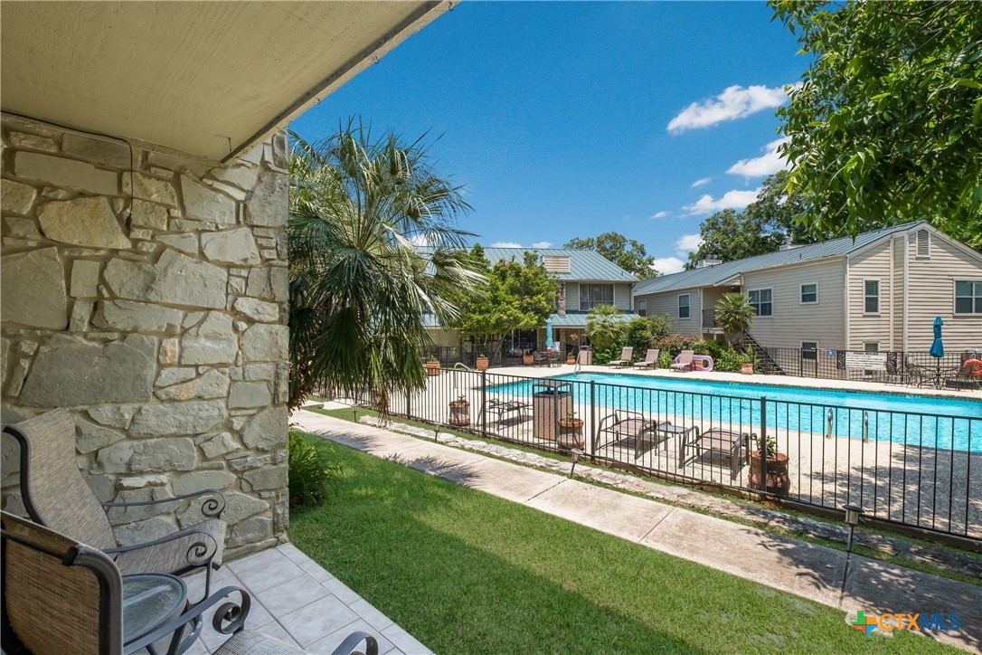 551 Terminal Loop Road, Unit D3 McQueeney, TX 78123 - Photo 1 of 1 a view of a house with backyard and sitting area