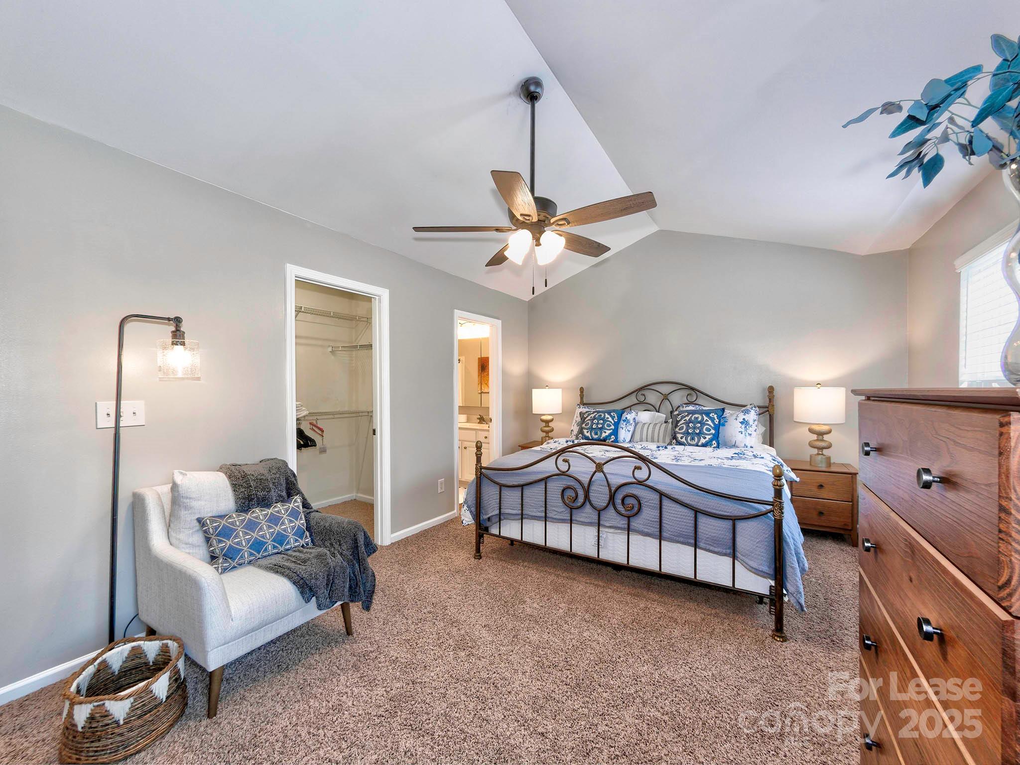 11316 Morgan Valley Lane Charlotte, NC 28270 - Photo 20 of 33 a living room with a bed furniture and a ceiling fan