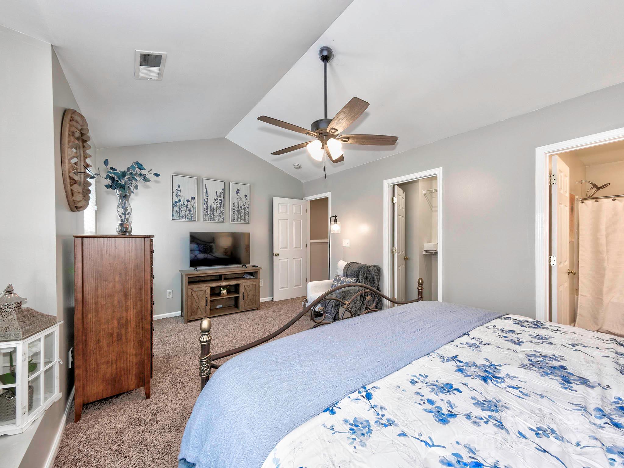 11316 Morgan Valley Lane Charlotte, NC 28270 - Photo 23 of 33 a bed room with a bed a television and dresser