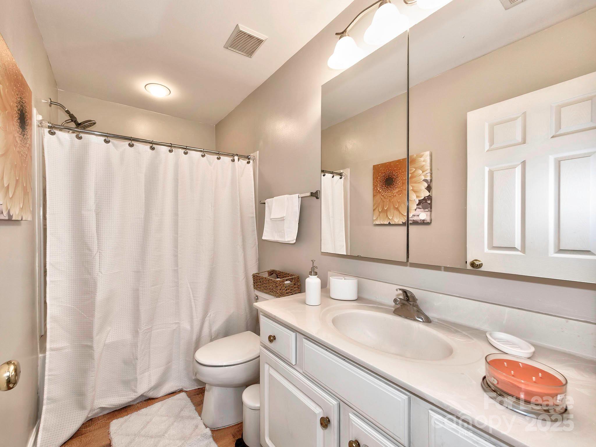 11316 Morgan Valley Lane Charlotte, NC 28270 - Photo 24 of 33 a bathroom with a granite countertop sink toilet and shower
