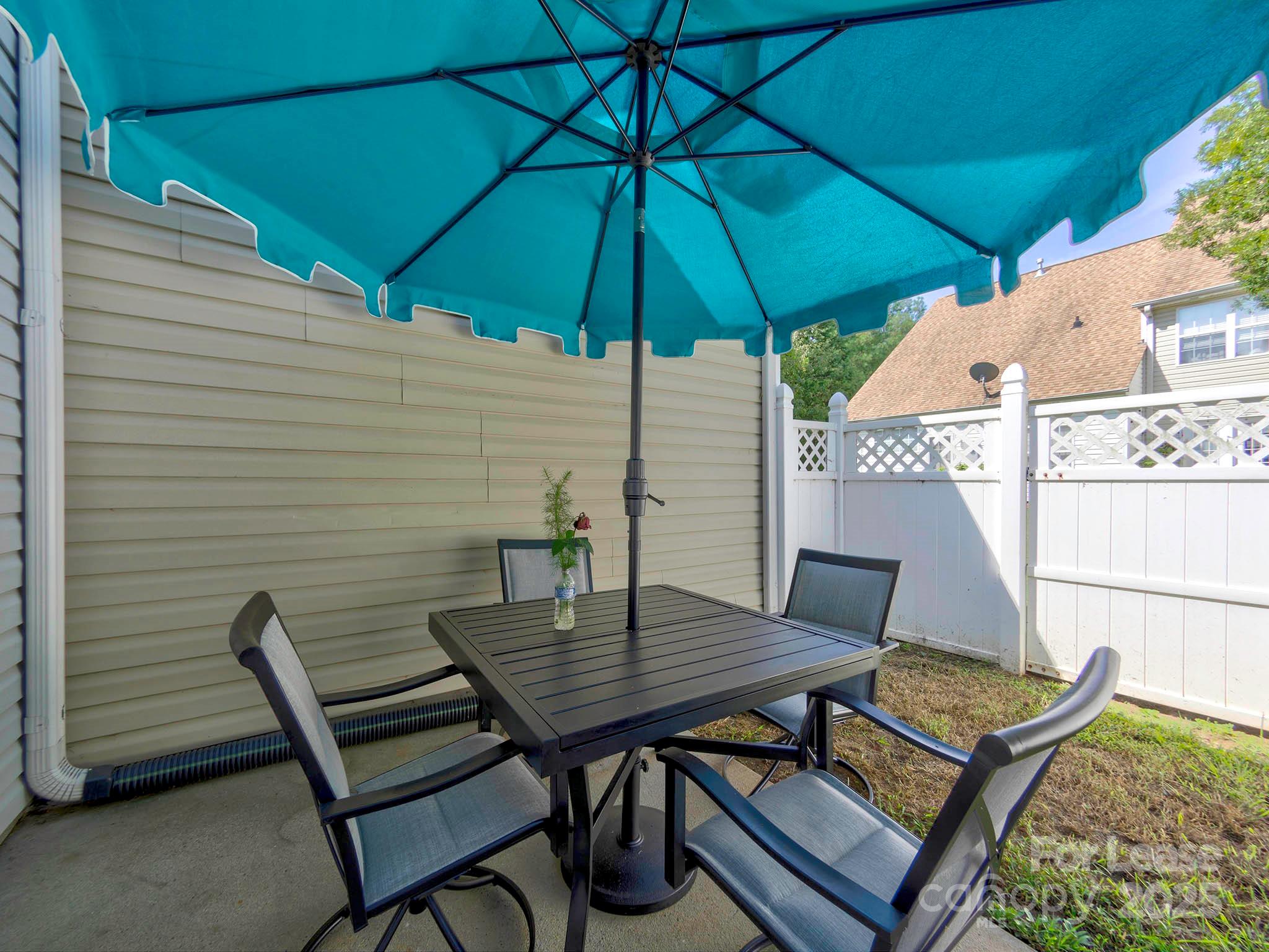 11316 Morgan Valley Lane Charlotte, NC 28270 - Photo 26 of 33 a backyard of a house with wooden floor yard and table