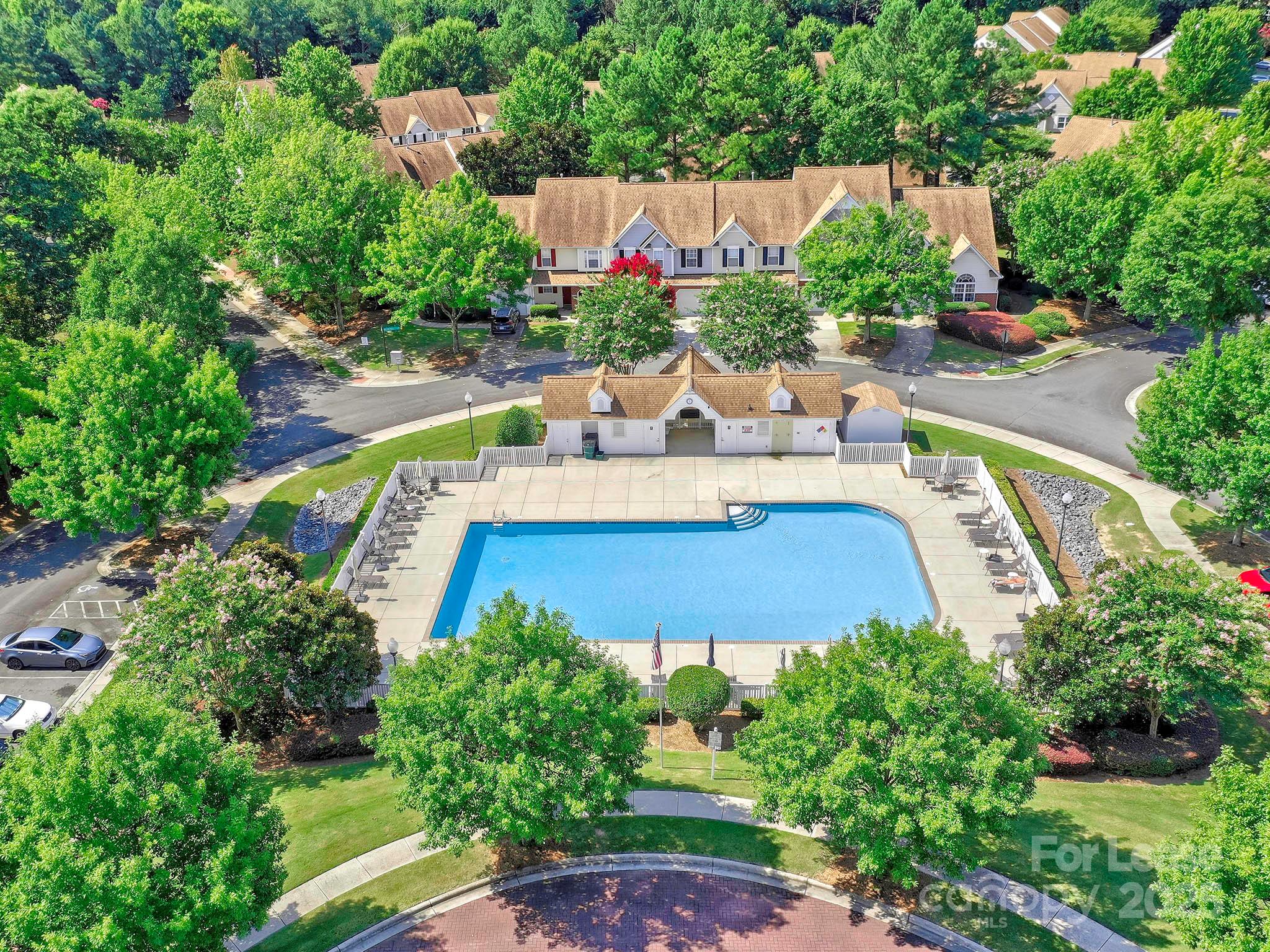 11316 Morgan Valley Lane Charlotte, NC 28270 - Photo 31 of 33 a view of a swimming pool with a patio and a garden