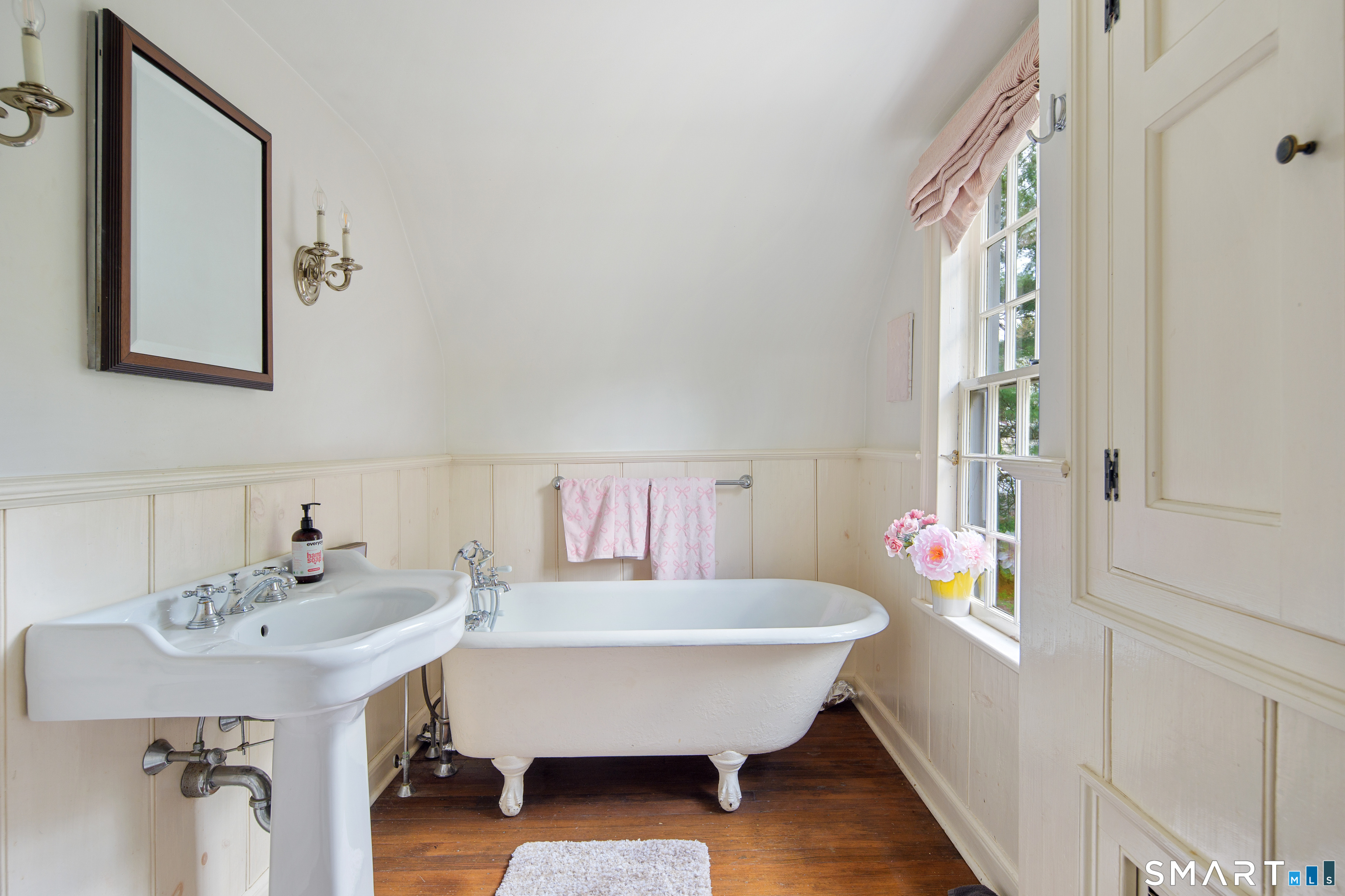 313 Umpawaug Road Redding, CT 06896 - Photo 27 of 40 a bathroom with a sink and a mirror