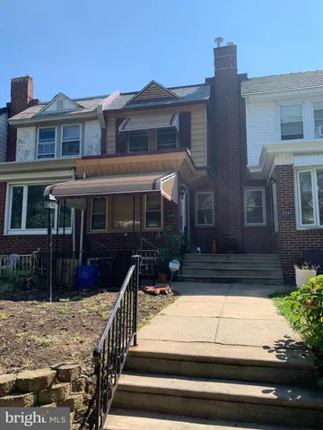 a front view of house with a yard