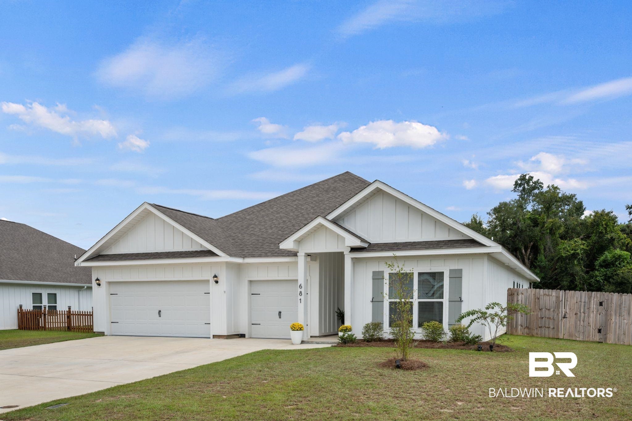681 Calibre Street Fairhope, AL 36532 - Photo 3 of 56 View of front of property with a front yard and a garage