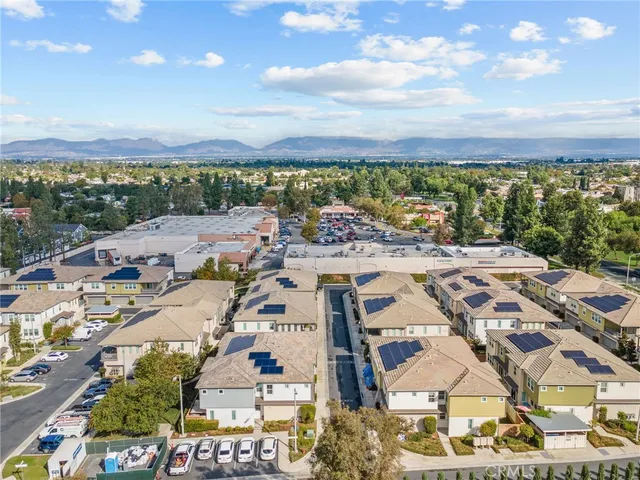 a view of a swimming pool with a patio and a garden