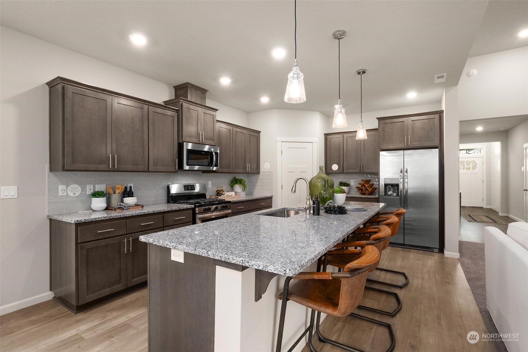 2825 South 6th Way Ridgefield, WA 98642 - Photo 8 of 26 a kitchen with kitchen island a sink stove and refrigerator