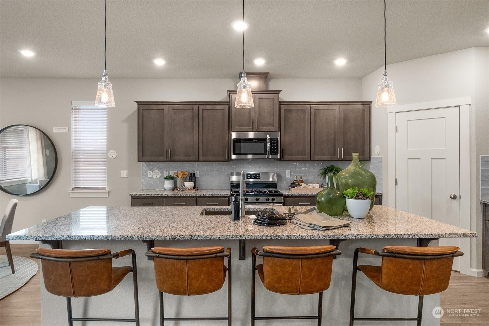 2825 South 6th Way Ridgefield, WA 98642 - Photo 9 of 26 a kitchen with stainless steel appliances kitchen island granite countertop a sink and cabinets