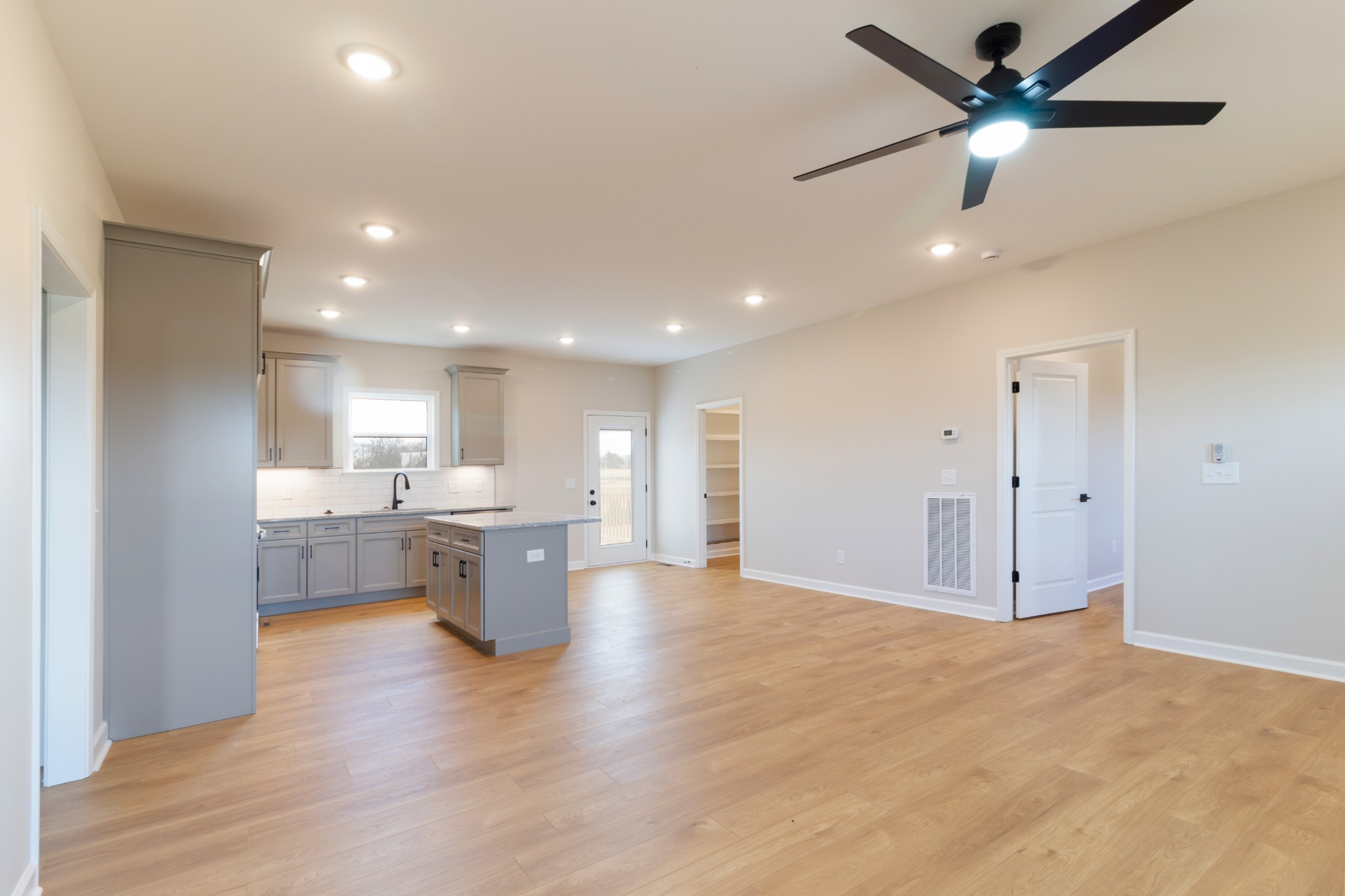 6170 Rocky Mound Road Westmoreland, TN 37186 - Photo 12 of 24 a view of kitchen with a sink and dishwasher a refrigerator with wooden floor