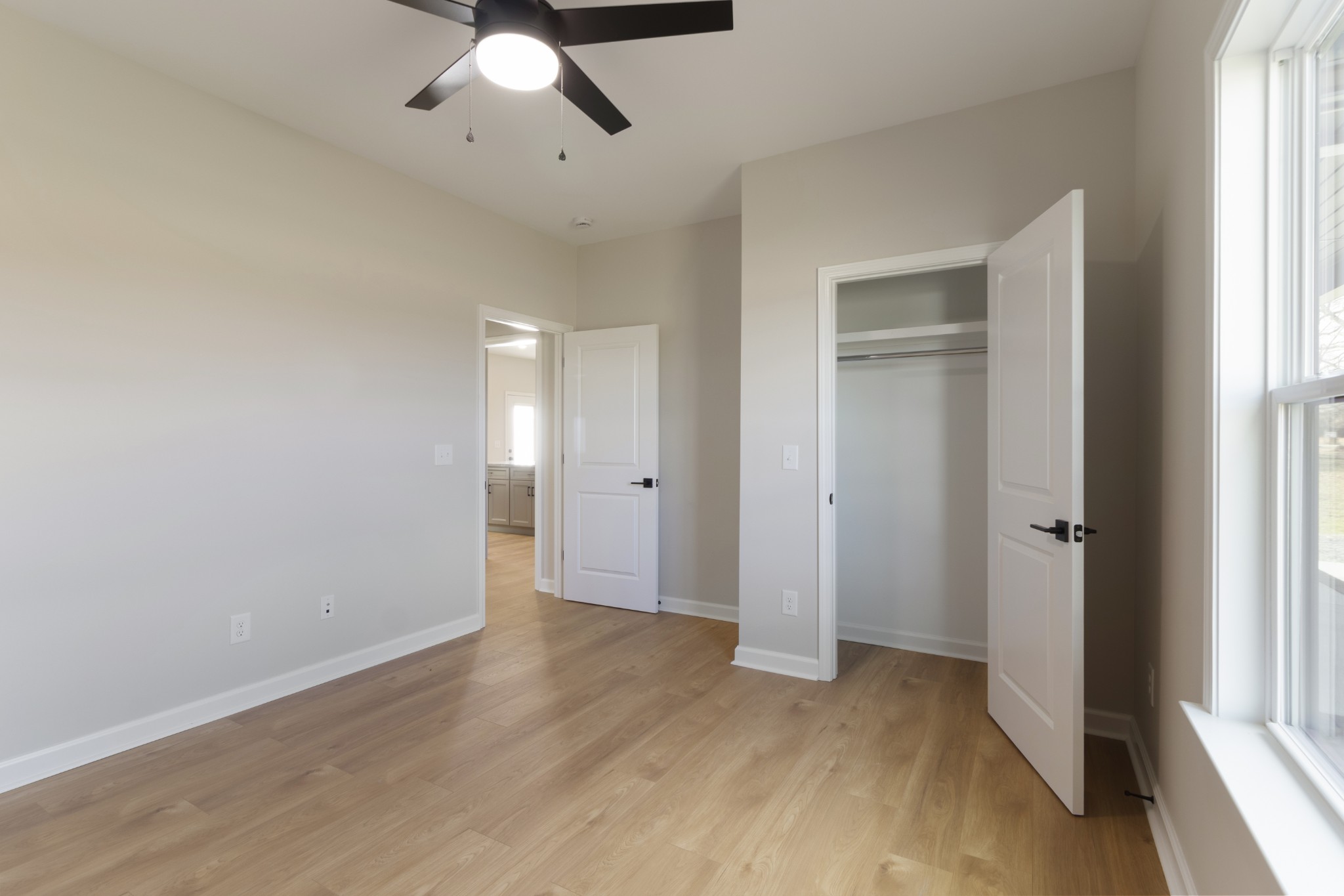 6170 Rocky Mound Road Westmoreland, TN 37186 - Photo 18 of 24 wooden floor in an empty room with a window