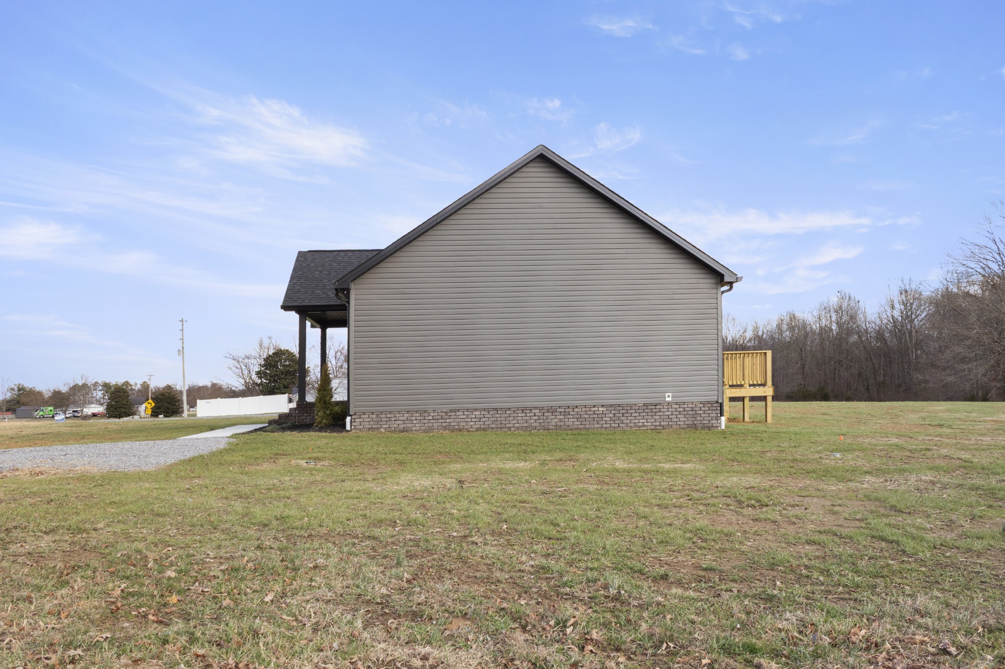 6170 Rocky Mound Road Westmoreland, TN 37186 - Photo 3 of 24 a view of a house with a yard and a garage
