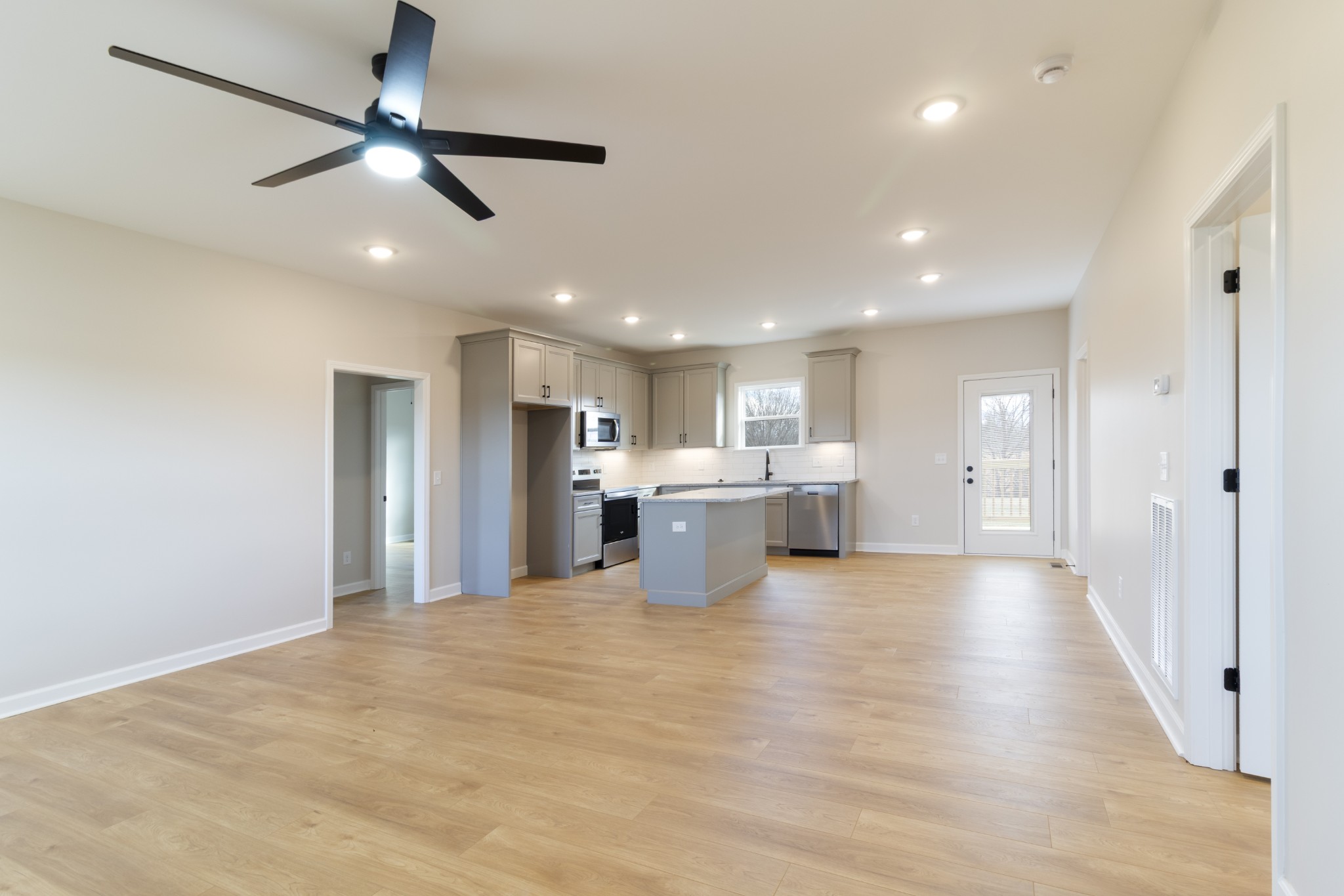 6170 Rocky Mound Road Westmoreland, TN 37186 - Photo 7 of 24 a view of a kitchen with a refrigerator and microwave