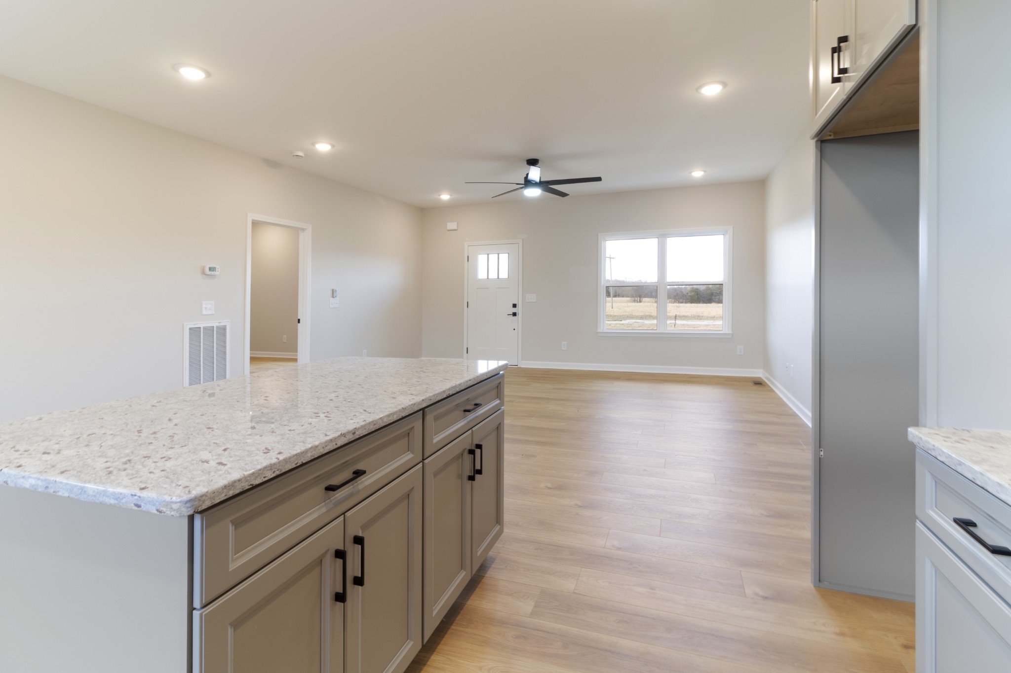 6170 Rocky Mound Road Westmoreland, TN 37186 - Photo 10 of 24 a bathroom with a granite countertop sink a large mirror and a shower