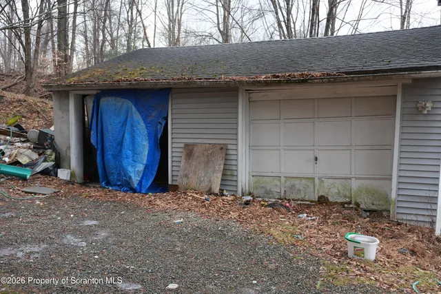 a picture of a bench in front of a wall